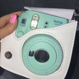 Polaroid camera with holding case
